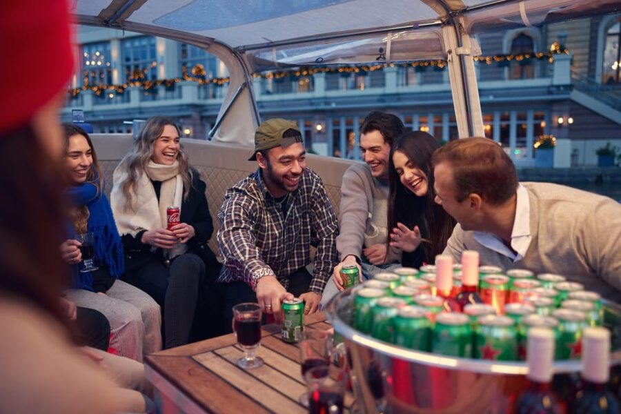 Amsterdam: Covered Canal Booze Cruise with Unlimited Drinks - A covered canal booze cruise that feels like a local night out