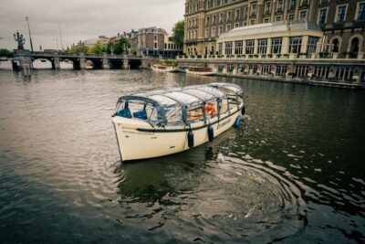 Amsterdam: Covered Canal Booze Cruise with Unlimited Drinks - The one-hour route: from Red Light District to the Seven Bridges viewpoint
