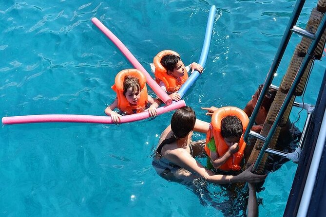Athens Riviera Half-Day Cruise – Swim, Lunch & Drinks Included! - The boat ride: comfort, music, and the crew vibe