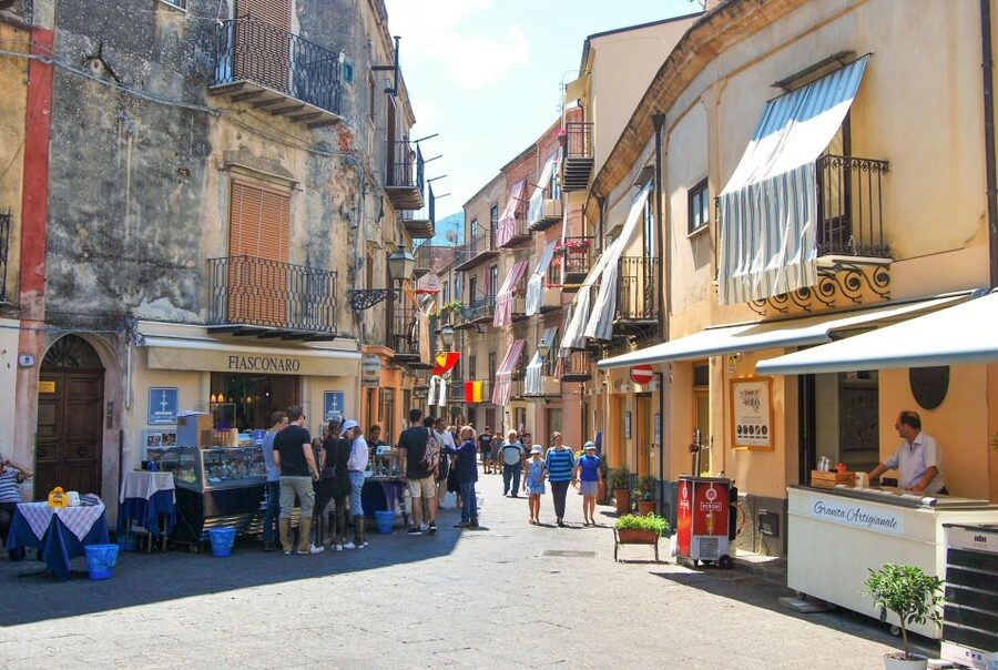 From Cefalù: Authentic Sicilian Villages and Happy Hour - Castelbuono First: Historic Streets, Castle-Square Energy, and a Panettone Moment