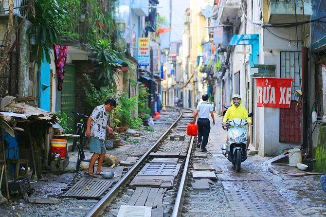 Hanoi city tour and drinking beside railway- group tour - Tran Quoc Pagoda: West Lake serenity with real age