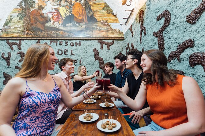 Madrid: Tapas Walking Tour with Food and Drinks Included - Calle de la Cava Baja: learning la hora del vermut with Manchego, fuet, and gilda
