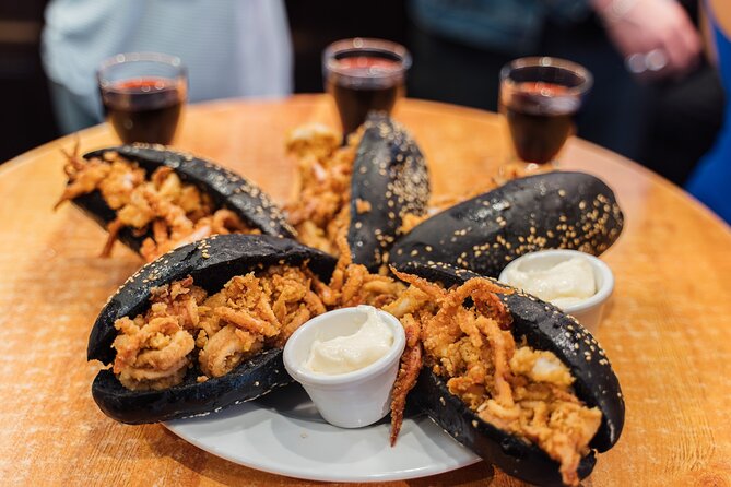 Madrid: Tapas Walking Tour with Food and Drinks Included - Calle de Toledo: squid-ink sandwich with calamari and Abuelo sweet wine