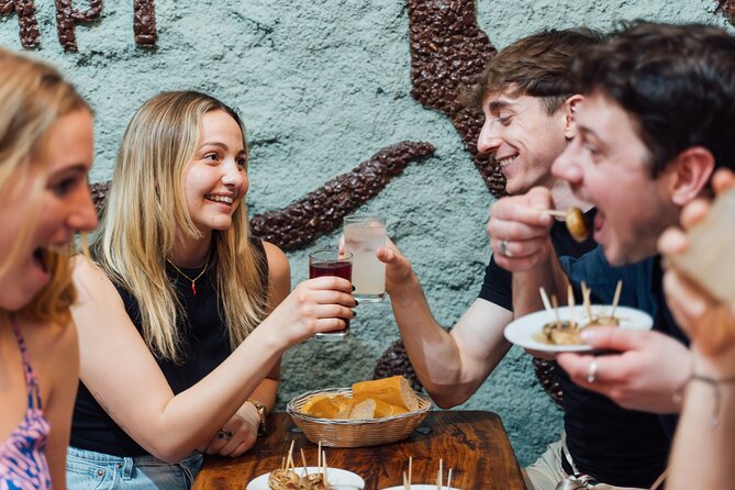 Madrid: Tapas Walking Tour with Food and Drinks Included - Centro de Arte Contemporaneo C3A: churros with piping hot chocolate to finish
