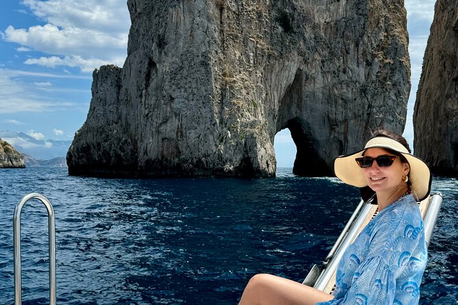 Private boat tour to Capri from Amalfi Coast. Drinks included - Faraglioni Rocks from the water: Stella, Mezzo, and Scopolo
