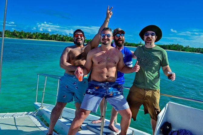 Punta Cana Booze Cruise with Snorkeling, Natural Pool & Open Bar - Getting on the boat at Bibijagua Beach