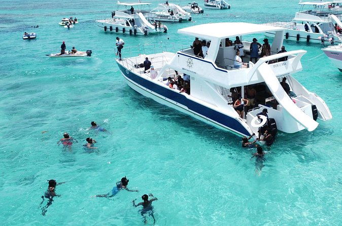 Punta Cana Shared Party Boat Booze Cruise and Snorkeling - The On-Board Experience: Drinks, Food, and Slide Time