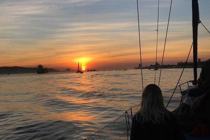 Sunset sailboat tour in Lisbon with green wine - Passing under the bridge near the pillars: the closest thrill moment